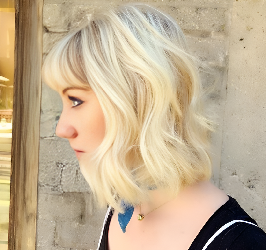 Summer blonde hairstyle by Hasblady Guzman at Bokaos Aveda hair salon in Pasadena showcasing vibrant sun-kissed hair colors