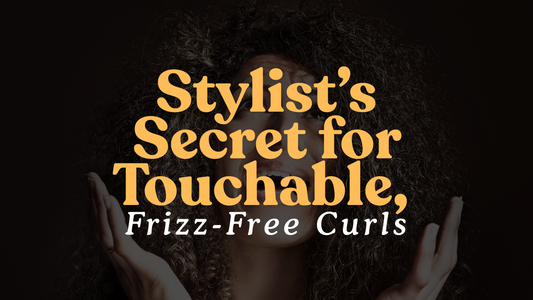 Stylist applying Aluram Curl Cream on curly hair at Bokaos Aveda salon in Pasadena for touchable, defined curls