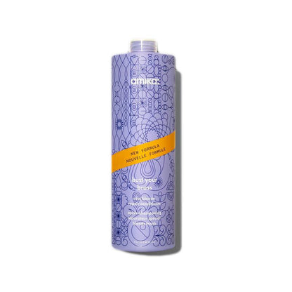 Amika Bust Your Brass Cool Blonde Repair Conditioner front bottle at Pasadena Aveda salon